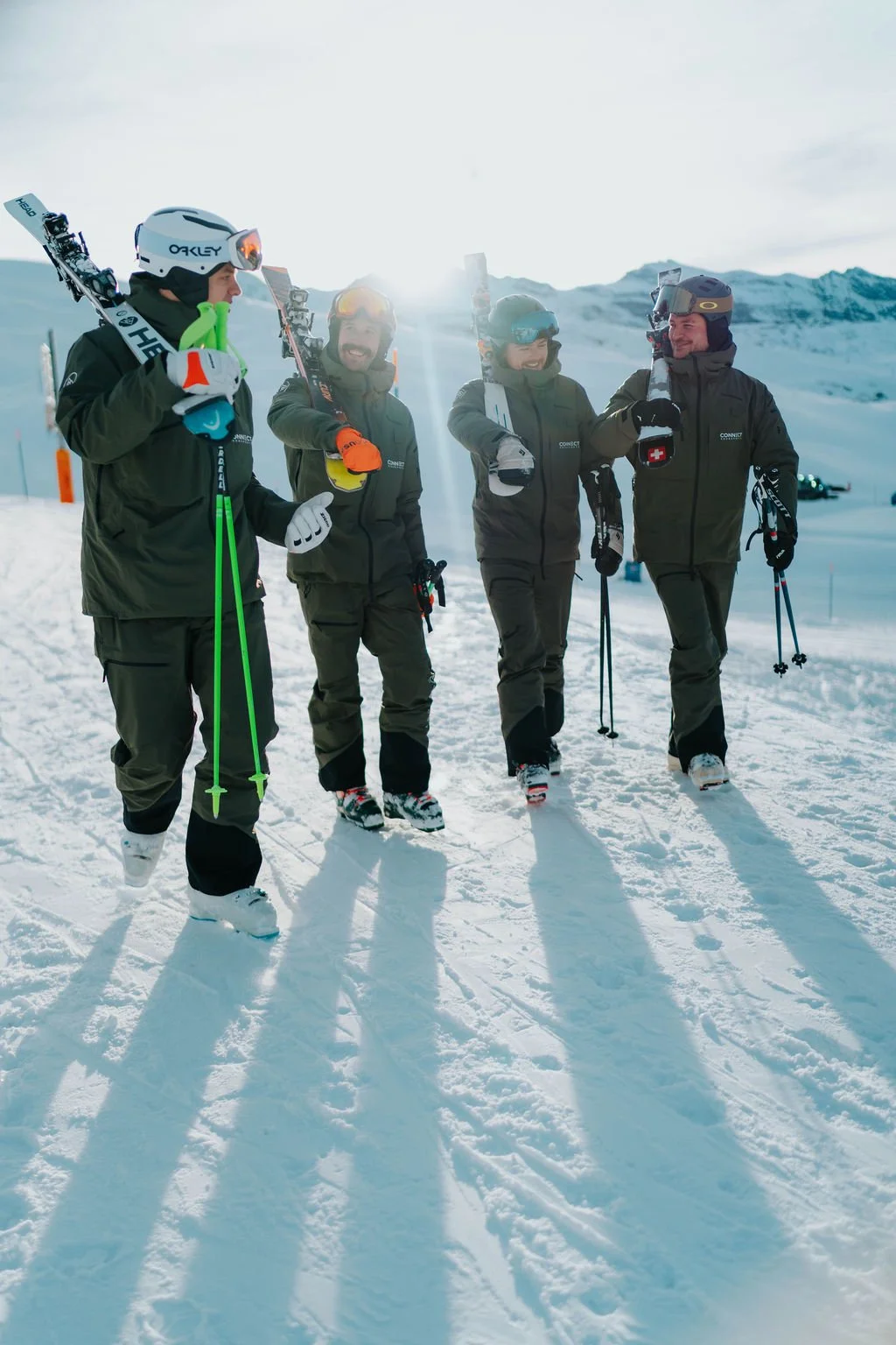 Some of the connect ski instructors walk together and laugh