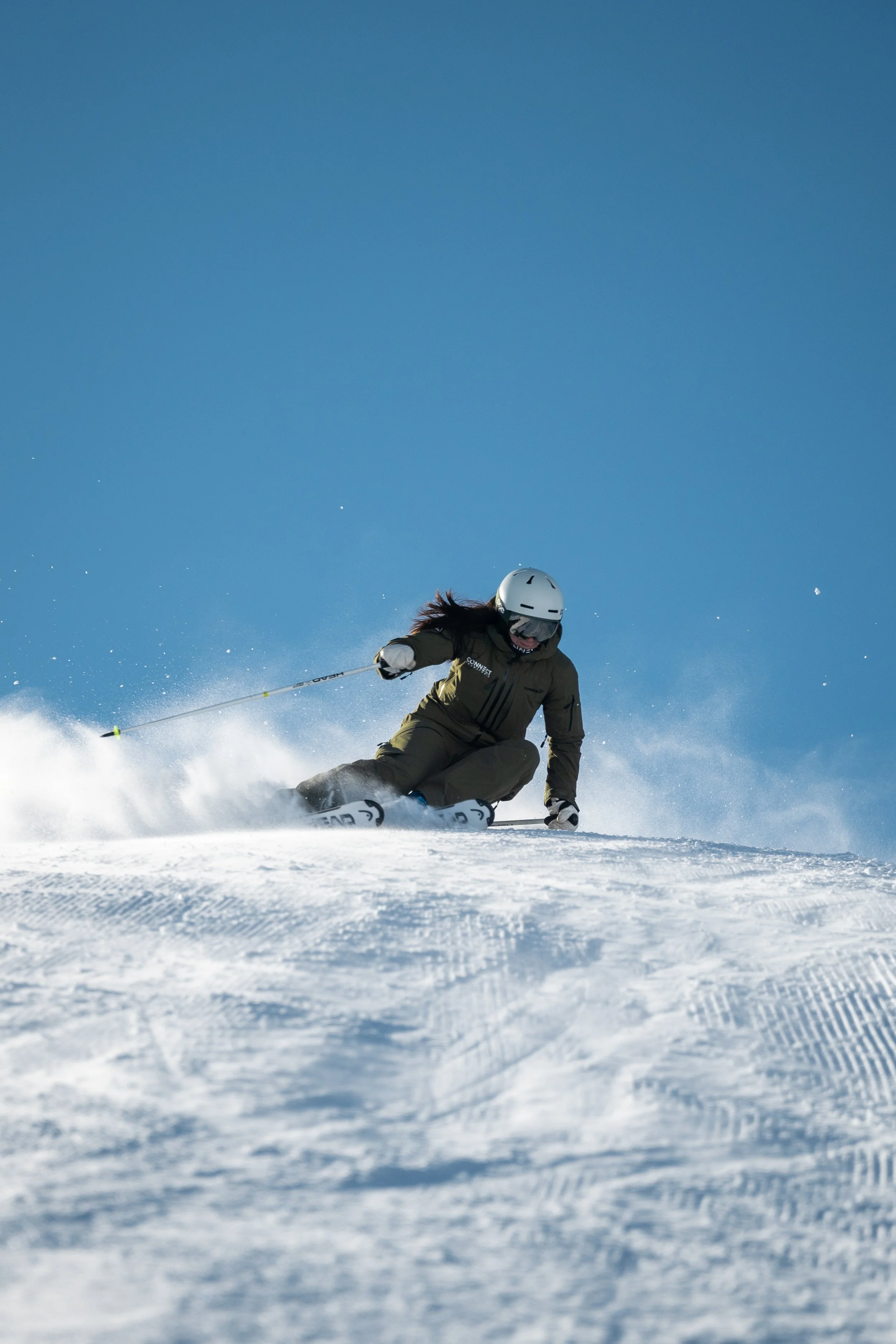 Ski instructor carving smooth turns on a groomed piste in Zermatt