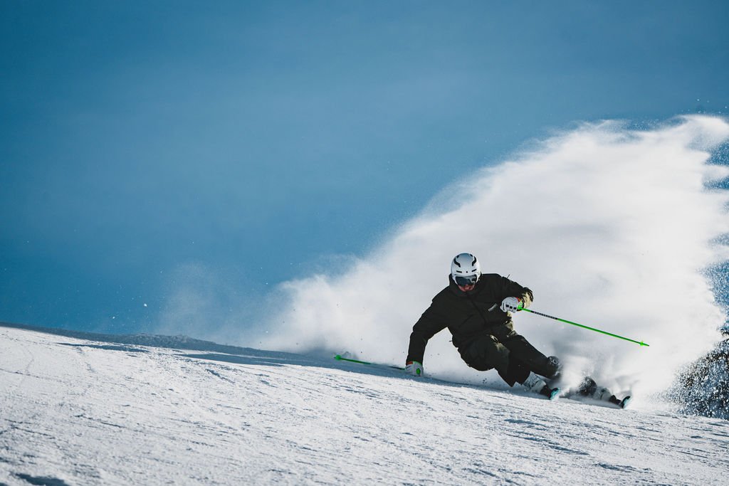 Advanced skier carving powerful turns during a private ski lesson in Zermatt during Ski instructor trainin