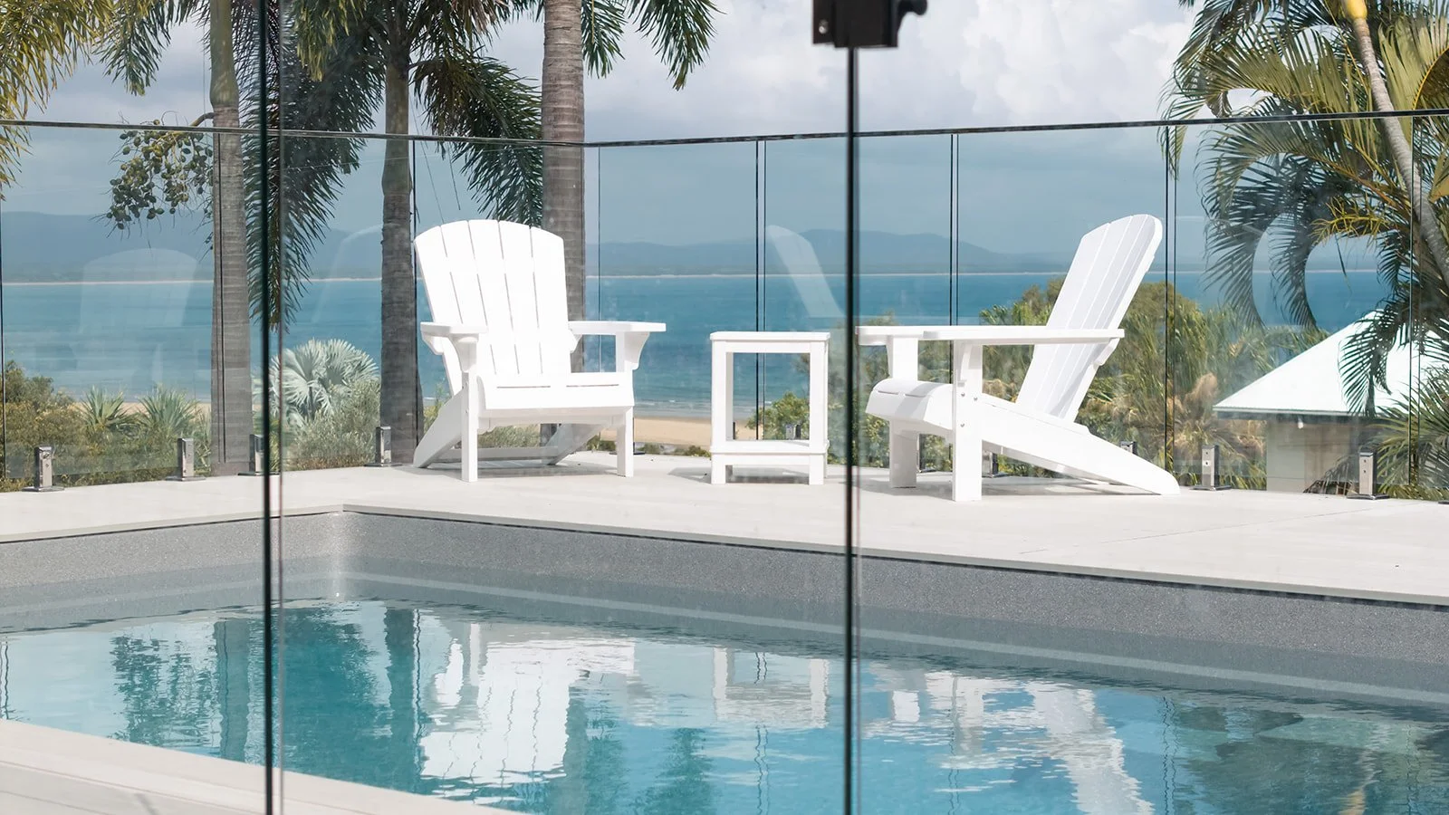 glass-fence-chairs-pool-landscaping-agnes-water-qld.jpg