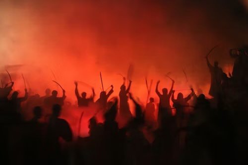 Bring Out Your Dead

Bring out your dead.
Through the canyons of New York,
where the towers once spoke in fire
and the air learned how to scream.
Where fear first named me.

Bring out your dead.
Through Paris,
where music burst into gunfire
and the f