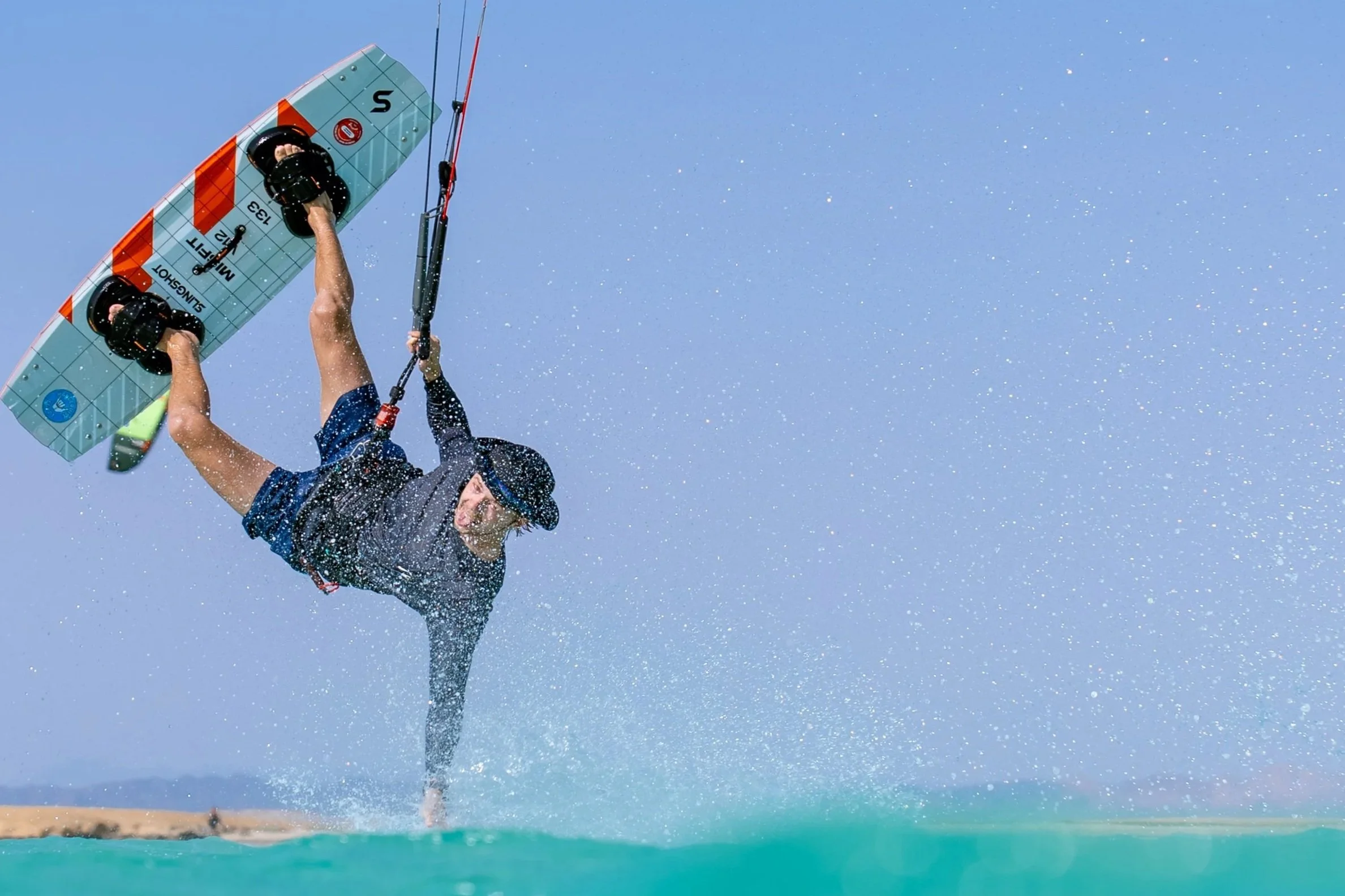 Kitesurfer doing a hand drag in the Red Sea
