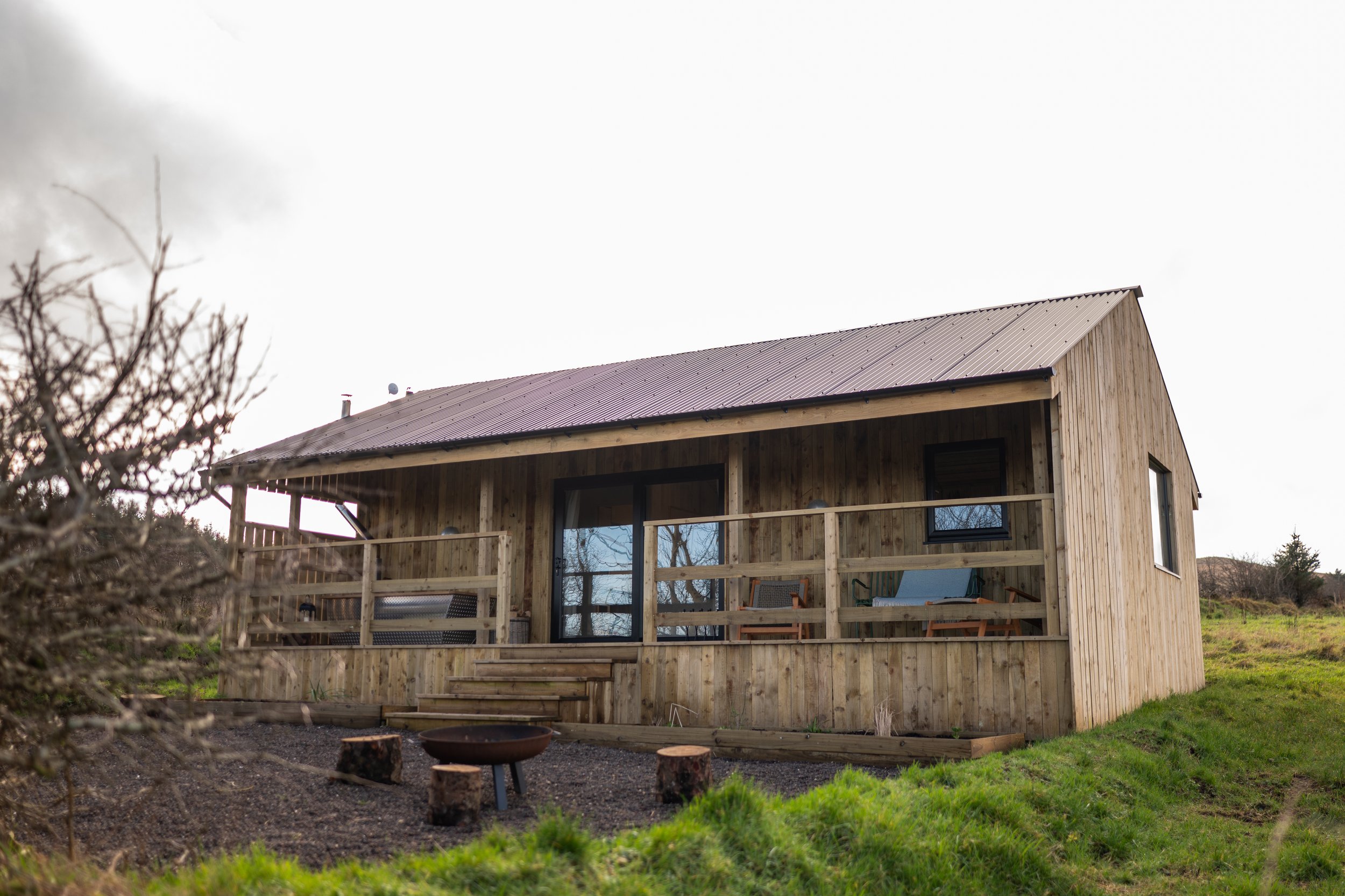 Front of Lir View cabin - wood fired bath on veranda and firepit