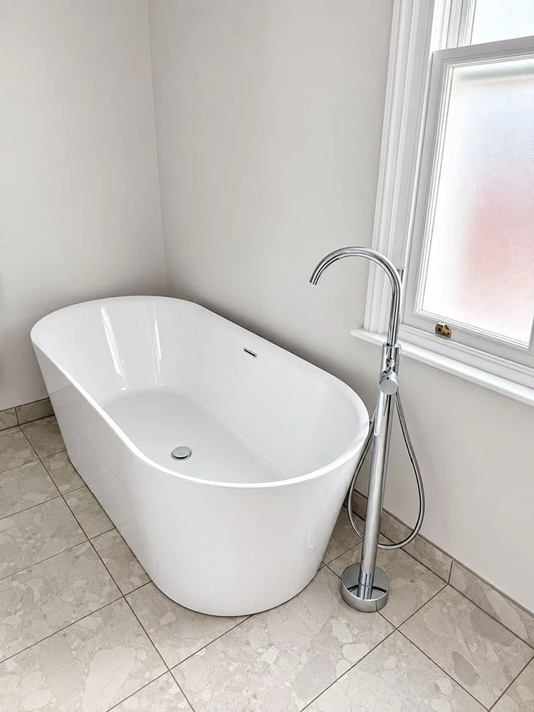 Freestanding bath with floor-mounted tap in the completed West Drive bathroom
