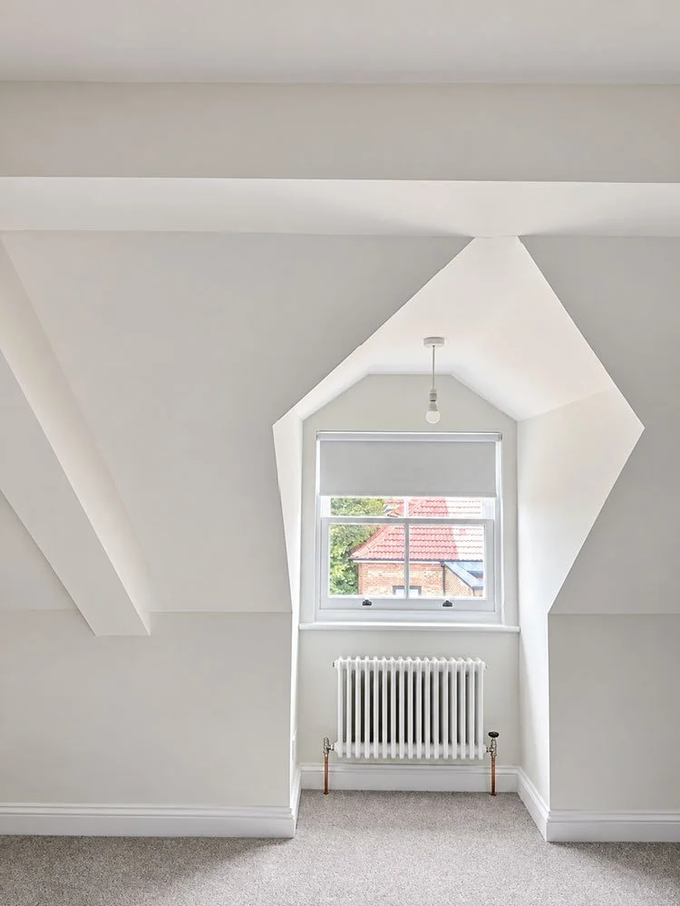 Finished loft room with dormer window, radiator and newly decorated interior at West Drive, Brighton