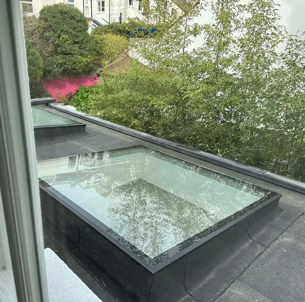 Flat roof detail with rooflight viewed from above on the West Drive extension