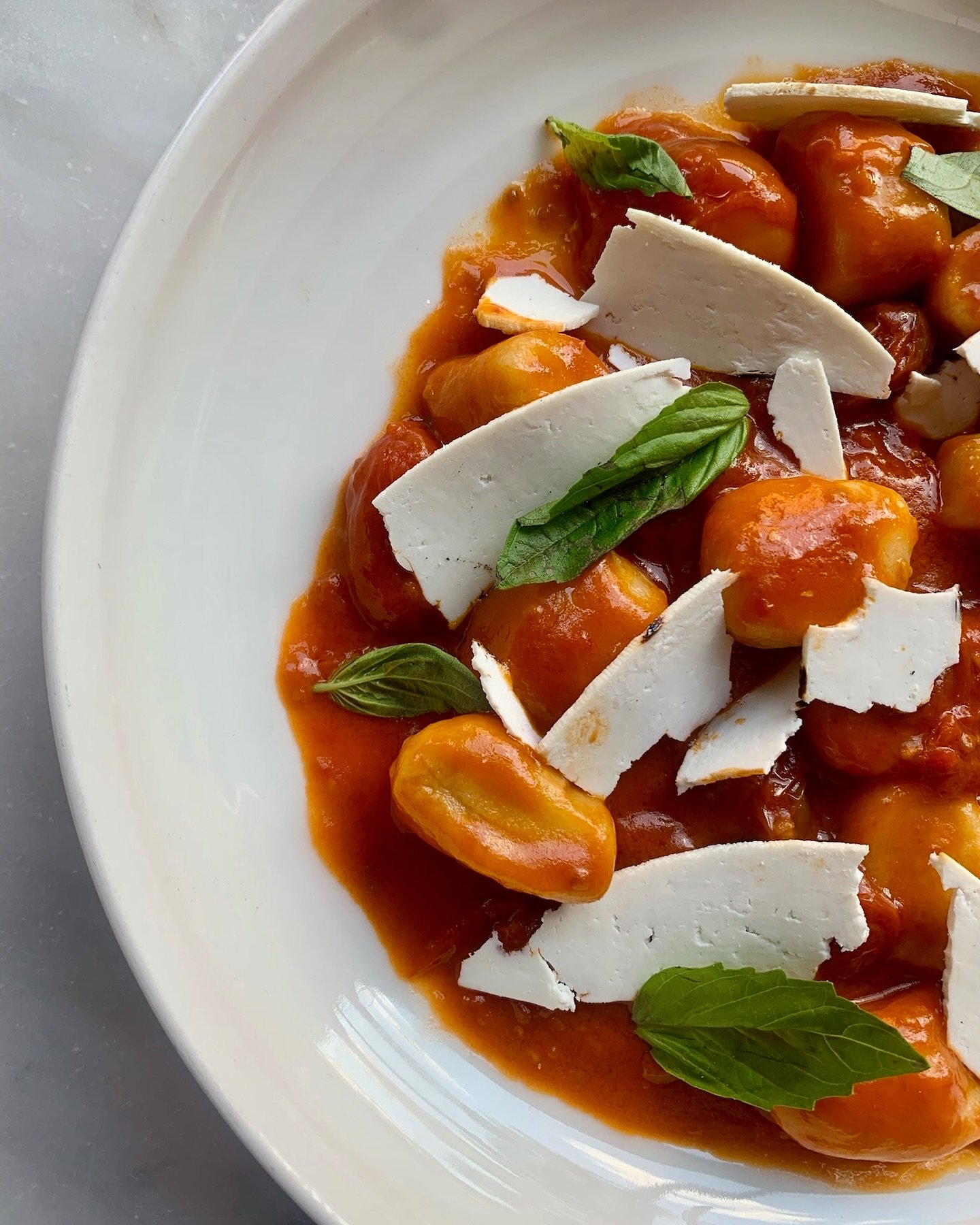 Gnocchi and shaved mozzarella in white bowl SRV Boston