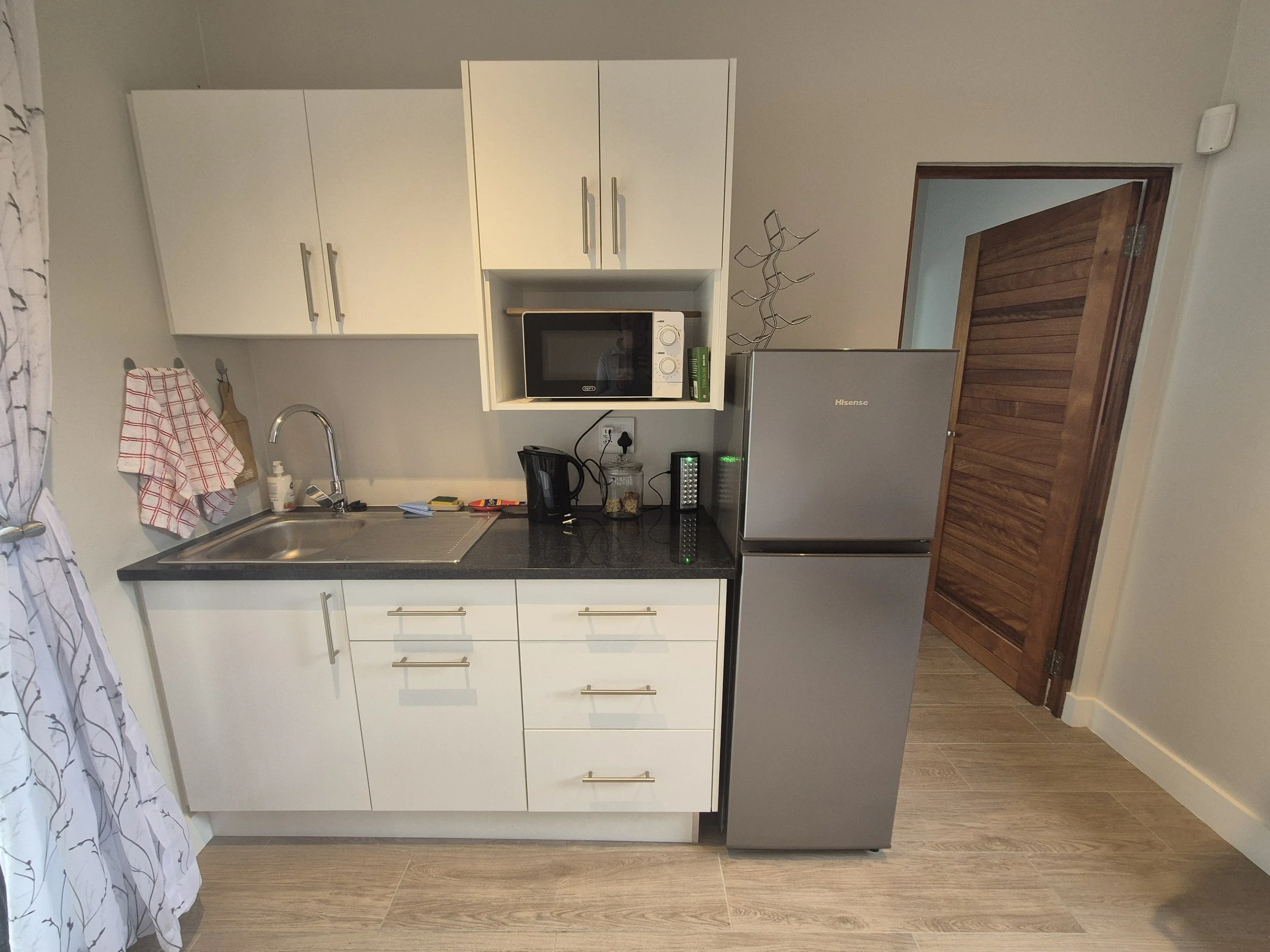 A fully kitted out kitchenette provides self catering guests with enough to prepare most meals including a microwave and snackwich toaster grill.