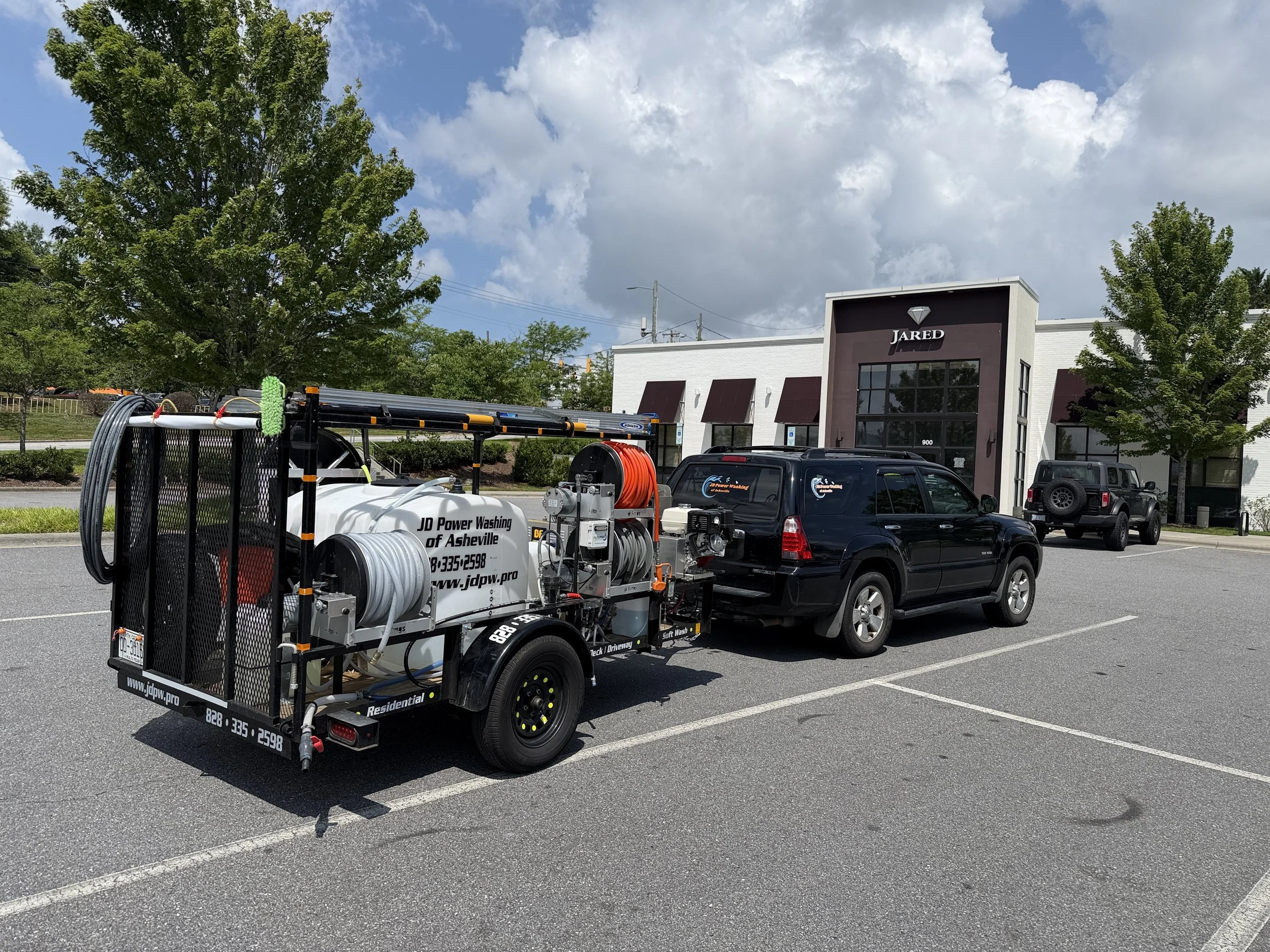 James' trailer in a commercial parking lot of Whole Foods Market on Tunnel Road.