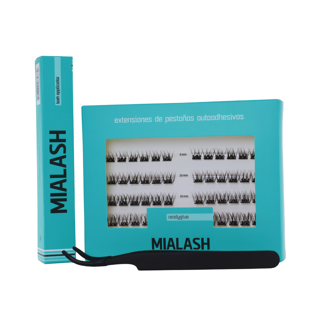 Box of false eyelash extensions in various lengths, labeled in Spanish, with black eyelash strips inside a light blue box.