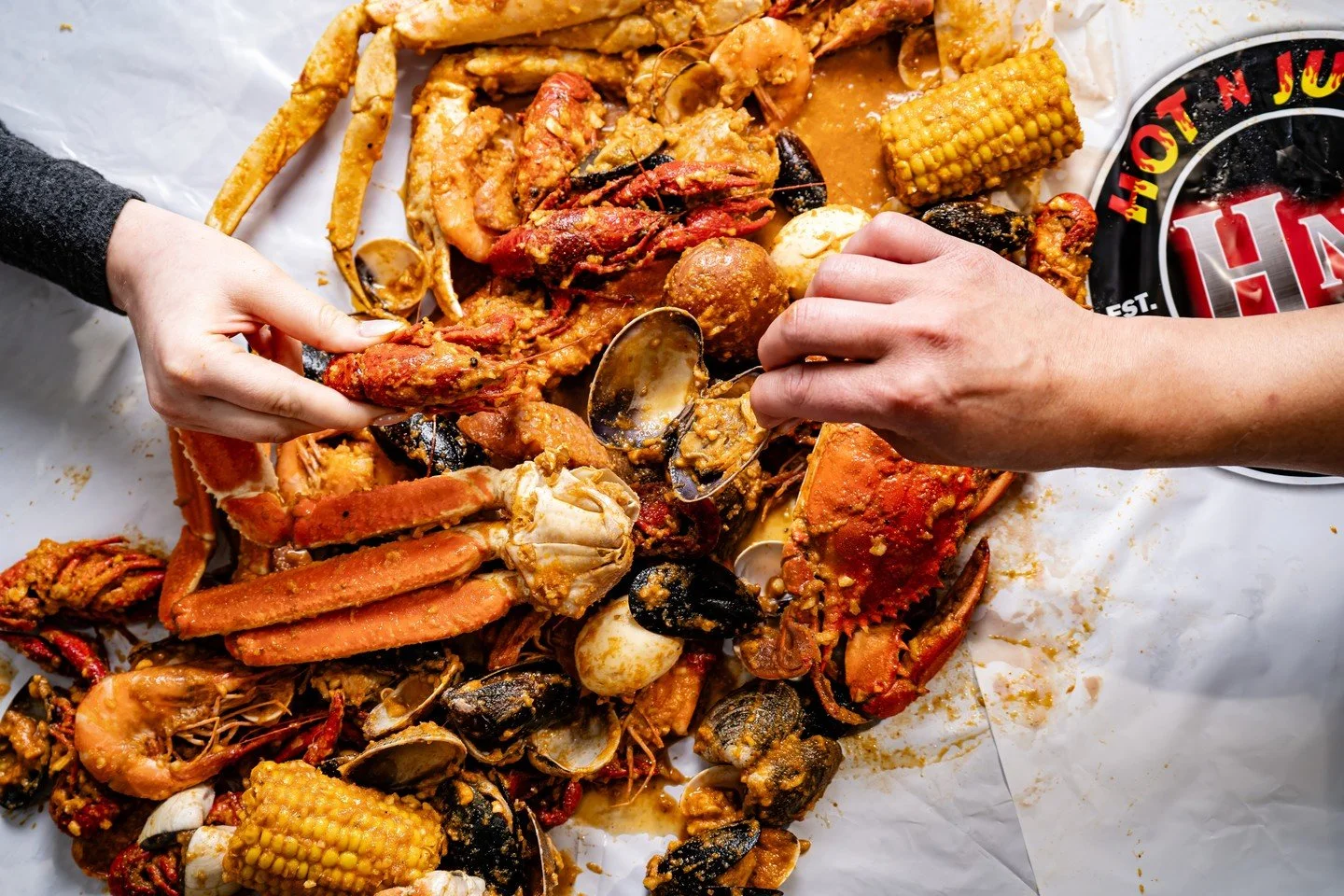 "Sorry, I can't. My hands are full." 🤭 We'll keep you busy at Hot N Juicy! #SeafoodBoil