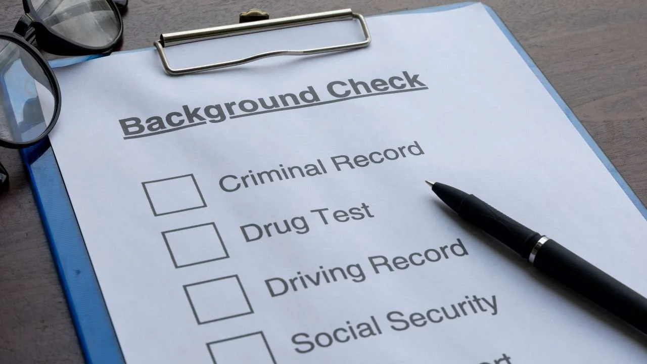 Background check report with checklist items including criminal record and driving history