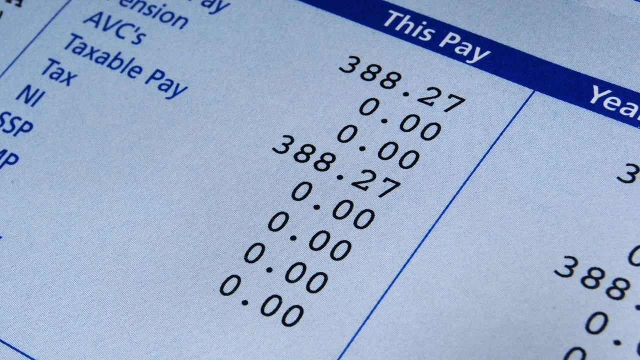 Pay stub representing wages at risk from debt collector garnishment threats