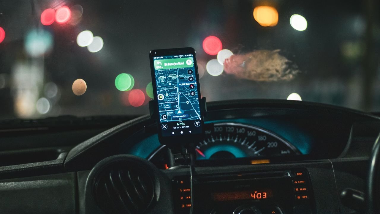 Lyft driver using navigation app during ride after background check approval