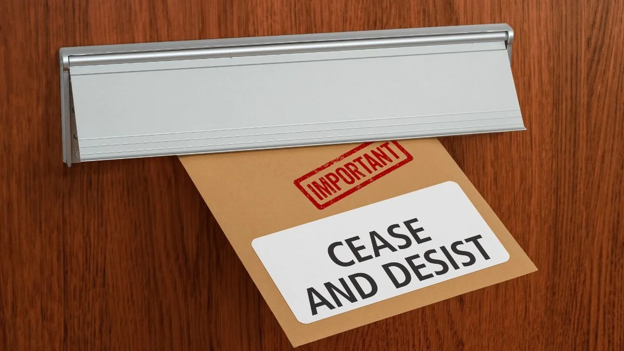 Cease and desist letter delivered through door mail slot, symbolizing legal action to stop unwanted robocalls and texts under the TCPA.