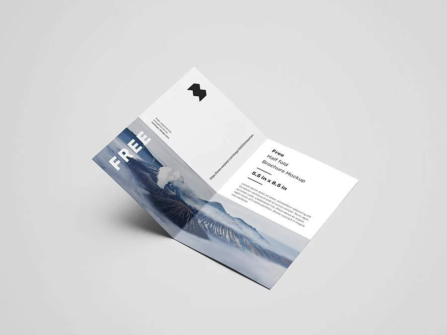A brochure mockup featuring a mountain landscape with clouds, displaying that it is a free, half-fold brochure measuring 4.5 inches by 8.5 inches.
