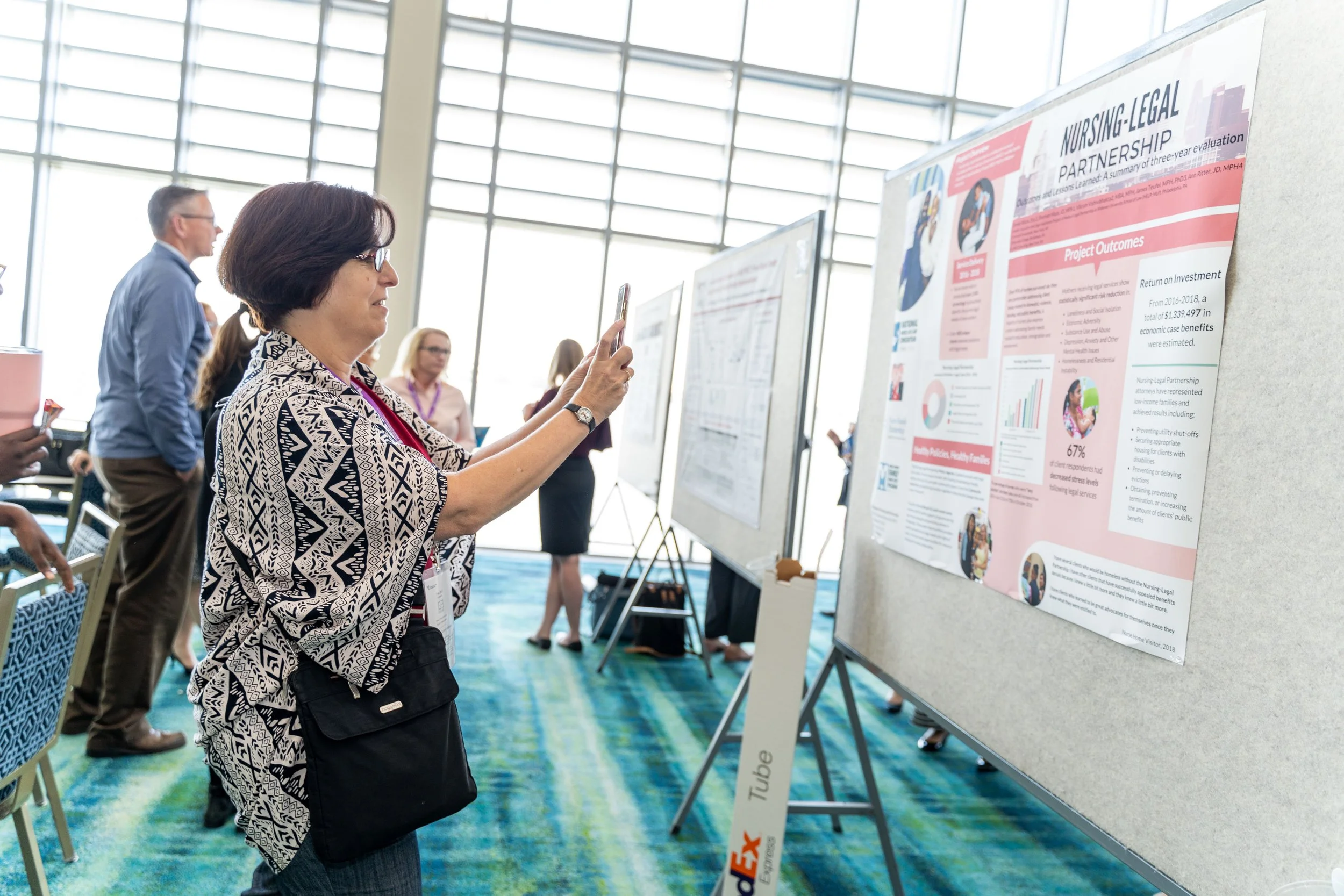  Attendees viewing research posters at the 2019 MLP Summit. 