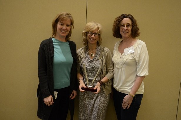 The Chicago MLPC team accepting an MLP award