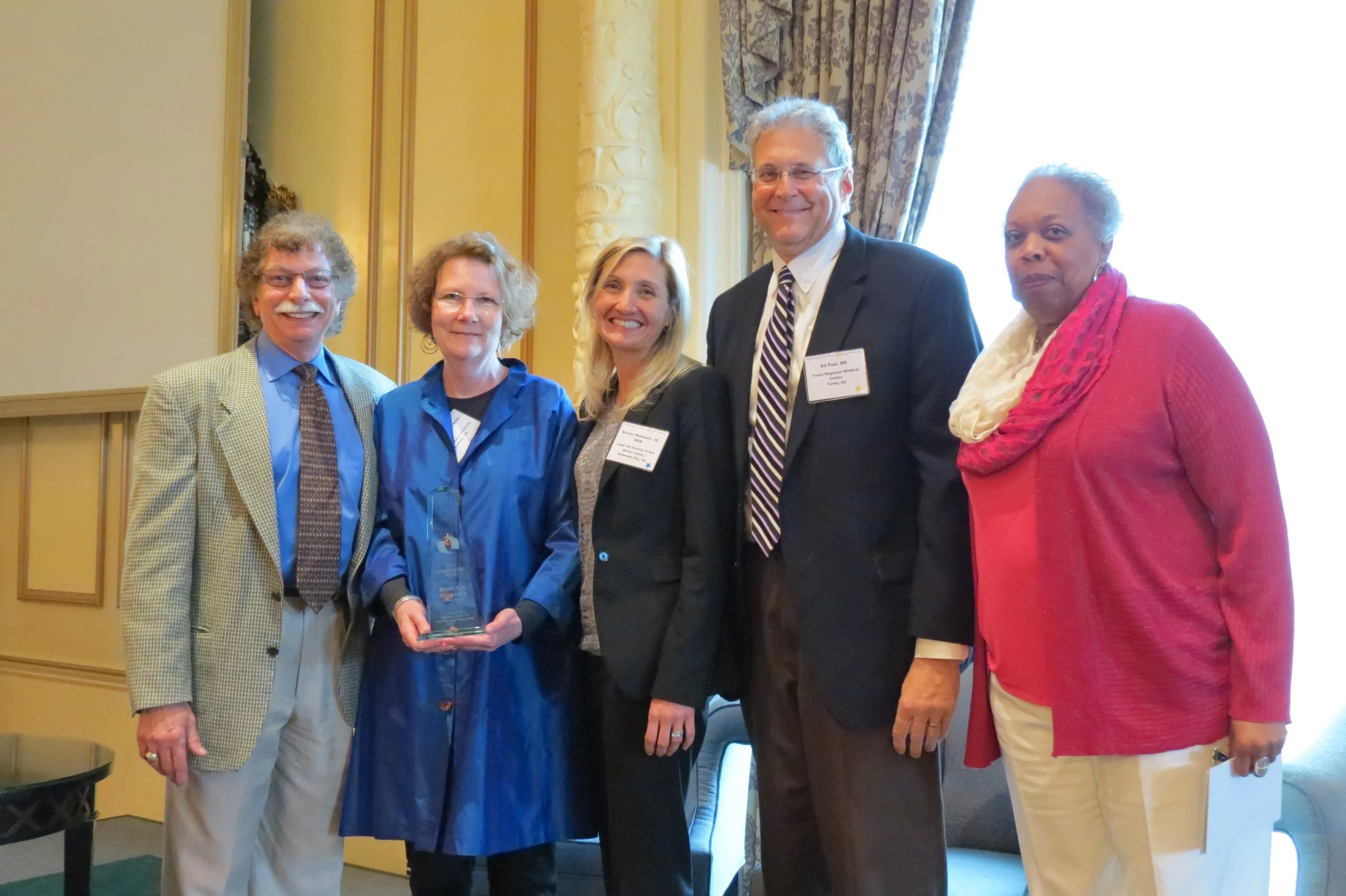 Dr. Bob Pettignano and Sylvia Caley from the Health Law Partnership accepting the 2014 Outstanding MLP Award.