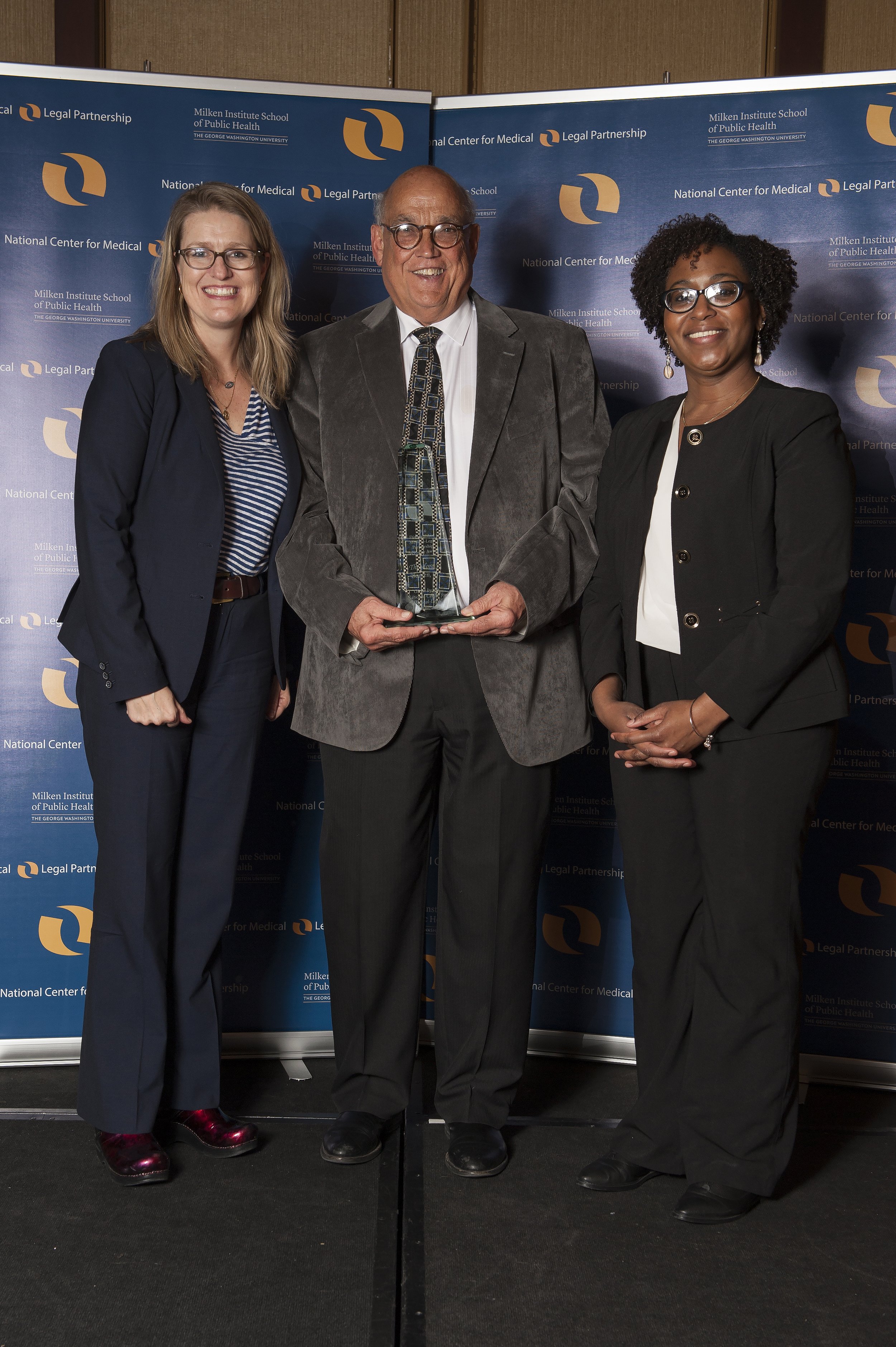 Ted Boesen (center) accepting the 2016 Distinguished MLP Advocate Award.