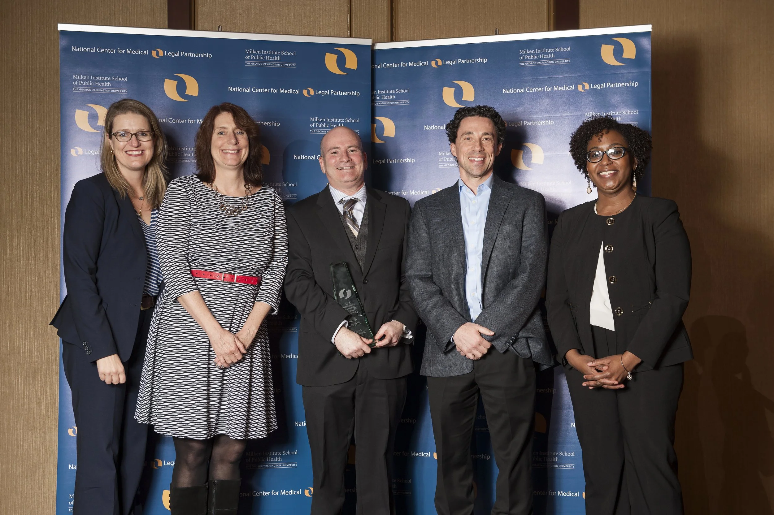 Dan Atkins (center) accepting the 2016 Distinguished MLP Advocate Award.