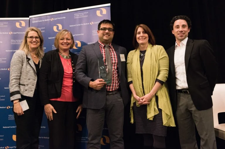 Meg Kovas from Eskenazi Health Midtown Community Mental Health and Jay Chaudhary from Indiana Legal Services accepting the Outstanding MLP Award.