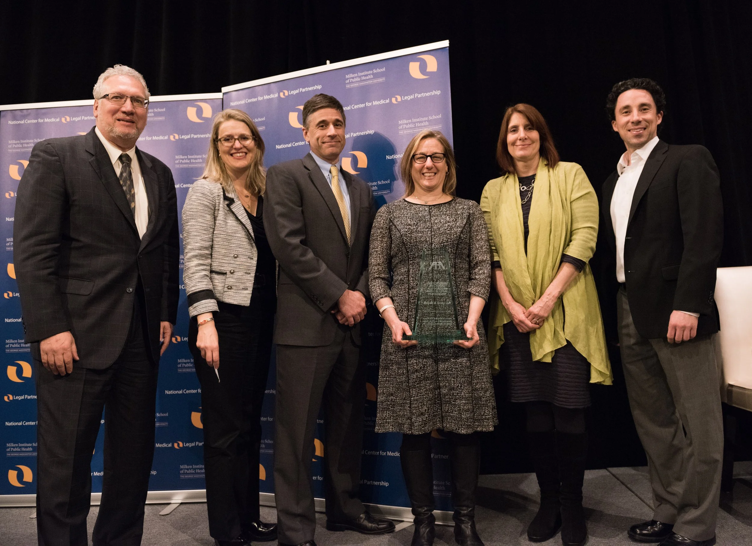 The team from Ropes & Gray accepting the ABA Outstanding Pro Bono Advocacy in MLP Award.