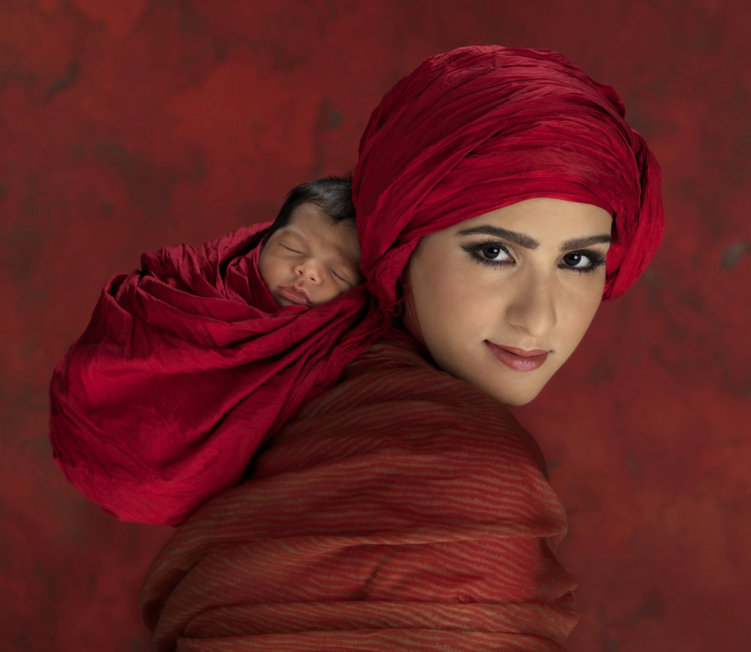 Hannah+Al-Bader+Handball+holding+Nahar+10+days+old_10725(1).jpg
