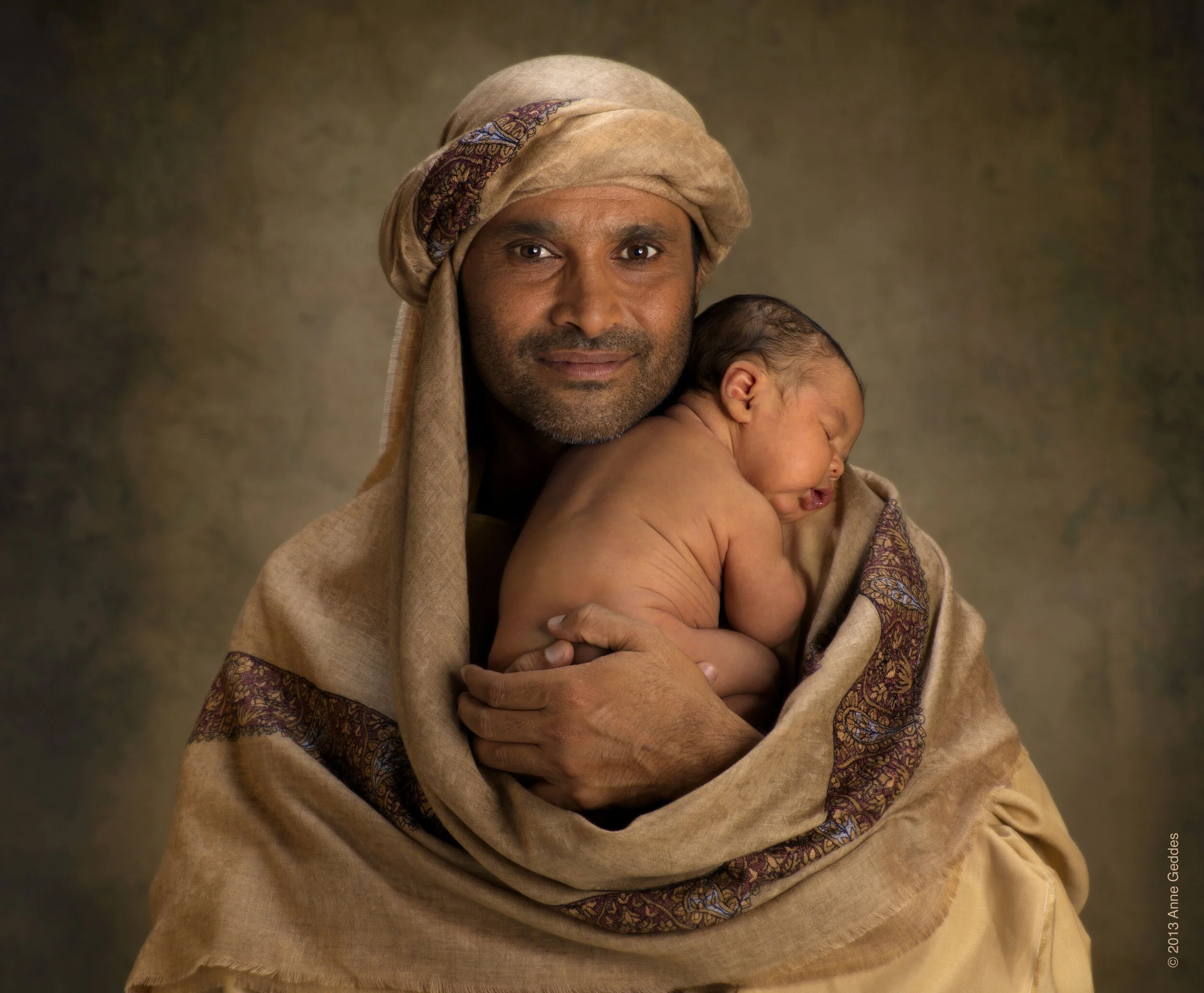 Nasser+Al-Attiya+(Rally+Driver+and+Shooter)+holding+Aedham+(14+days+old)(1).jpg