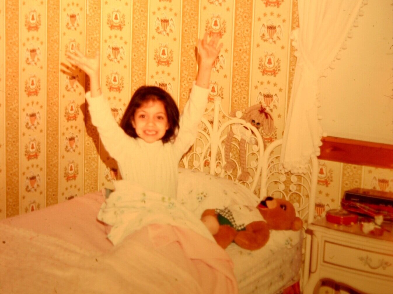 Here is a photo of me from 1976, waking up with the joy you’d typically expect to see in any child surrounded by bicentennial-themed wallpaper.