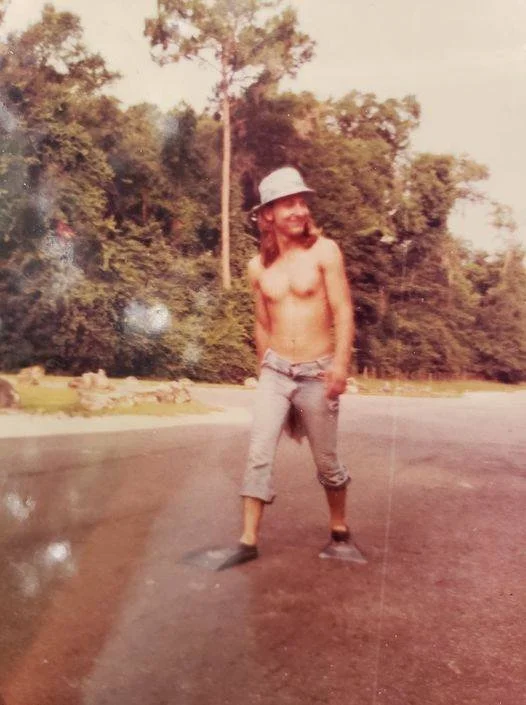 Young Chris walking in swimming fins on S. Lizella Road.