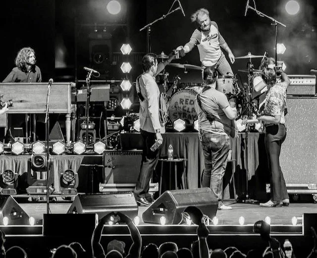 Brotherhood in black and white — half huddle, half high-wire act