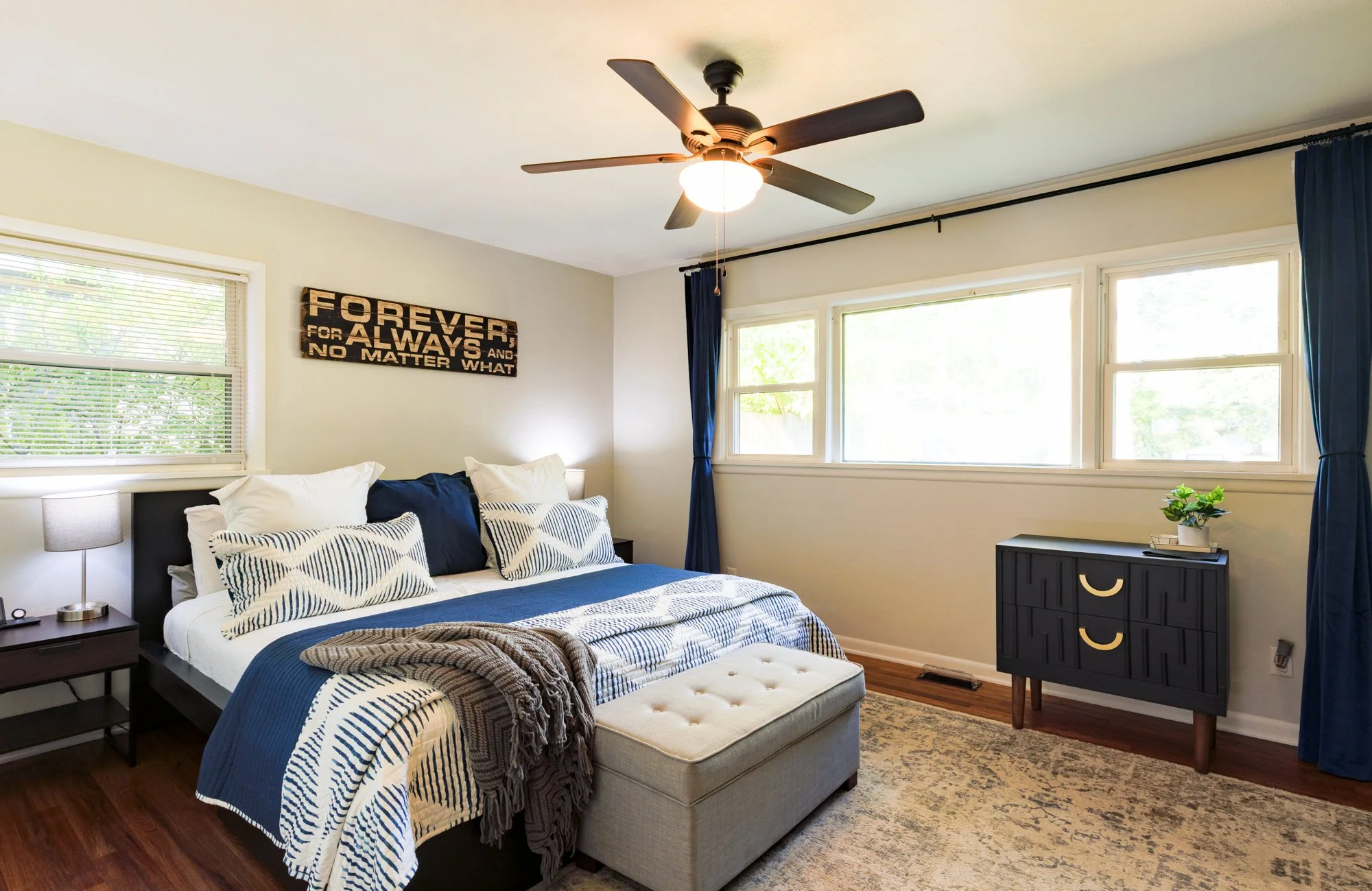Gorgeous primary bedroom with plenty of windows providing ample natural lighting and a cieling fan