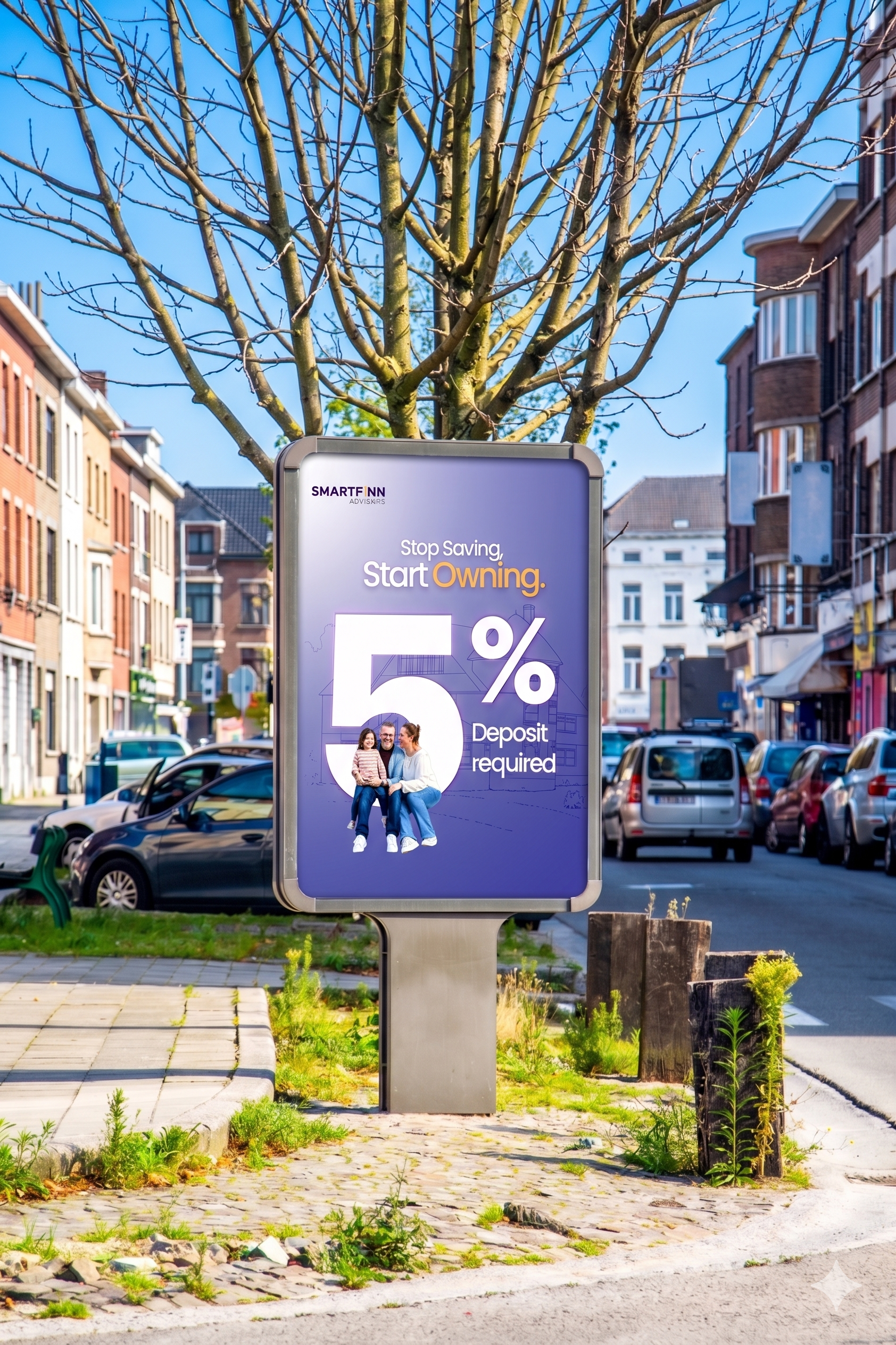 An outdoor advertisement board in a city street with a message about starting to own a home with a 5% deposit requirement. The board features a family of three smiling and sitting together. The background includes parked cars, multi-story residential