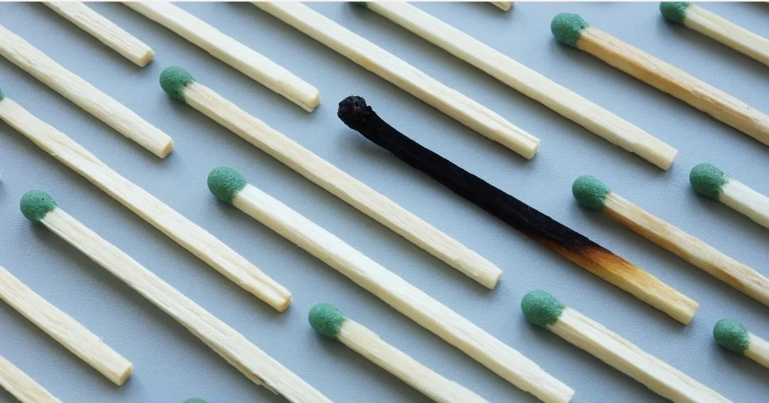 a series of matches with one burnt out.
