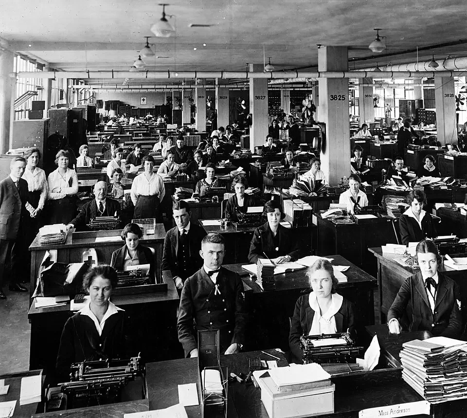Rows of women typists working in a 1920s office typing pool
