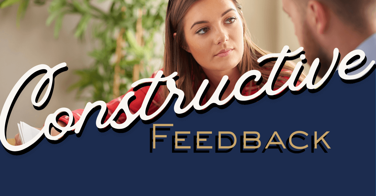 Leadership Cartography blog header for constructive feedback showing a professional manager in a focused conversation.