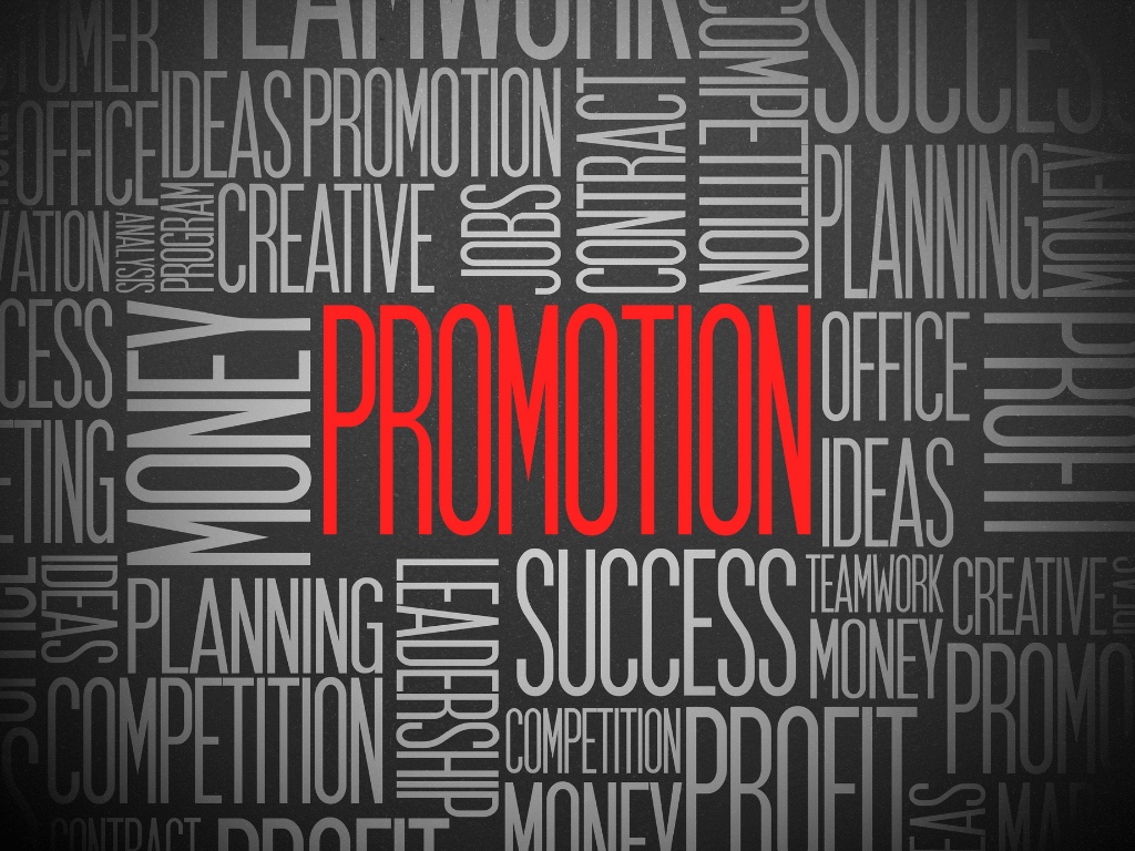 Manager leading a team meeting after a peer promotion, illustrating the peer-to-manager authority transition and rebuilding trust.