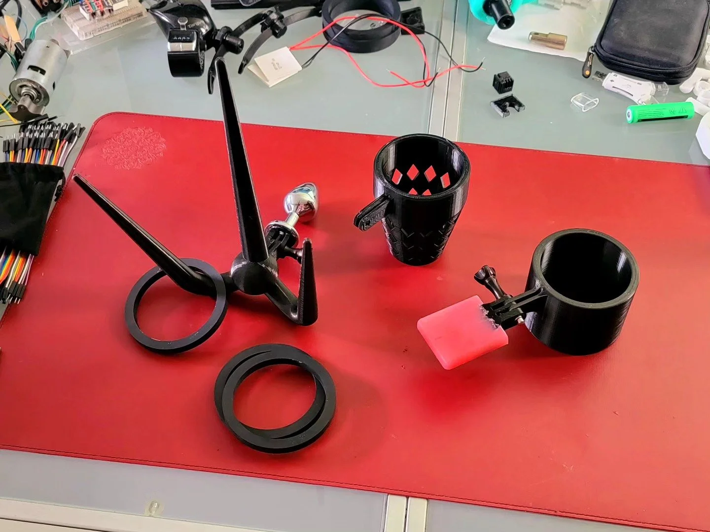 A beer holster? A waste paper basket? Ashtray? Ring-toss game? With both a plug attachment and a mouthpiece? Other suggestions are welcome. 
All that remains is to print a nipple clamp attachment. 

#bdsm #diy #kink #predicament #punishment #3dprint