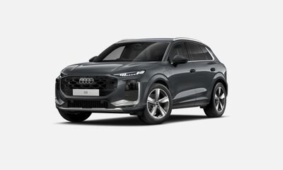 Black Audi e-tron SUV against a neutral background.
