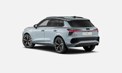Silver SUV car with black wheels on a plain light gray background.