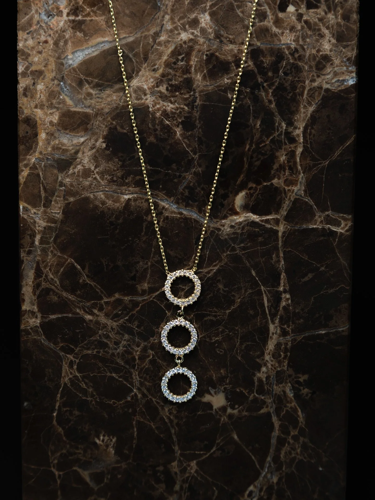 The Nada Necklace is designed around a timeless concept: the connection between past, present, and future.

Each of the three interlinked circles represents a moment in time &mdash; where you&rsquo;ve been, where you are, and where you&rsquo;re going