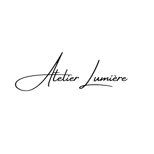 Logo with the text 'Atelier Lumière' in elegant cursive font on a white background.