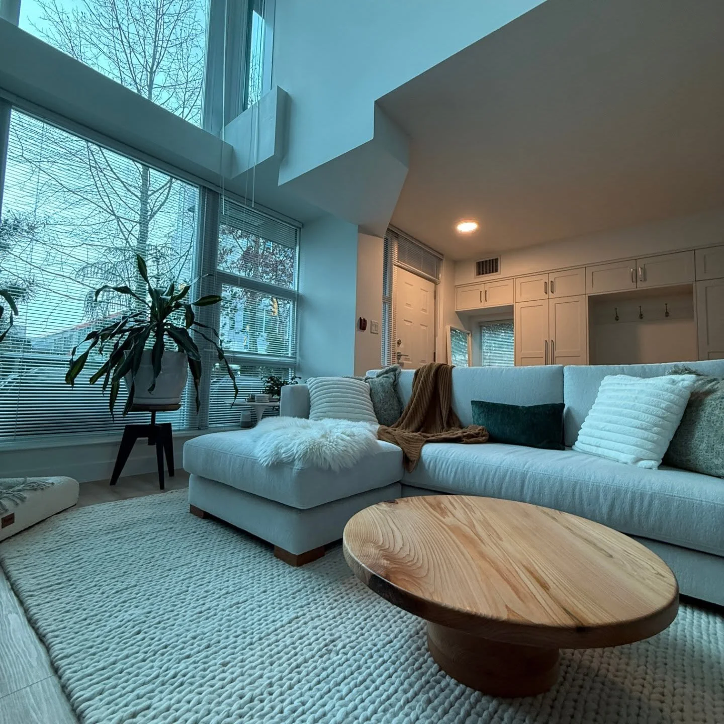 Custom ultra low profile coffee table looking ultra sleek in it's new home.

Made from 1 full slab of locally grown cedar. 29&quot; round table top with 12&quot; wide rounds glued together at 10.5&quot; total height.

Modern. Minimalistic. Timeless.
