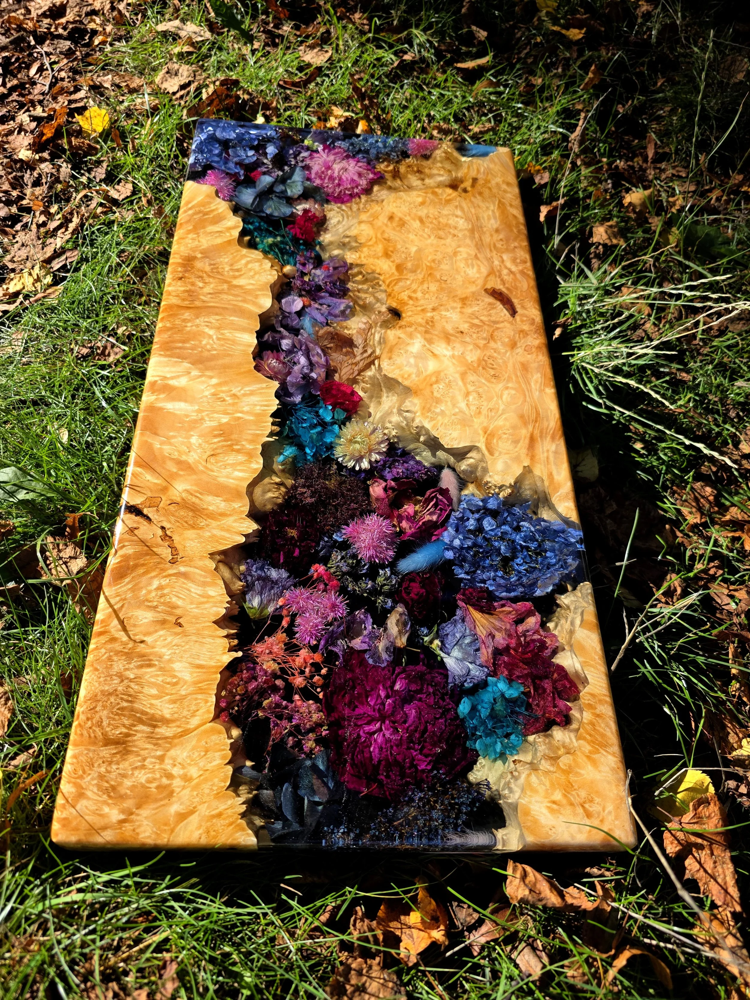 custom resin charcuterie board with dried flowers and maple burl live edge wood by Haig Designs