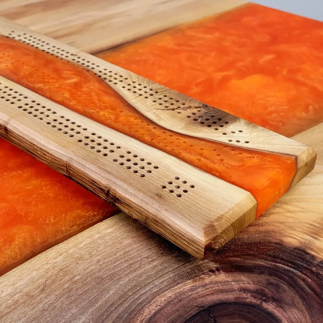 Live edge English walnut dining table with orange epoxy resin