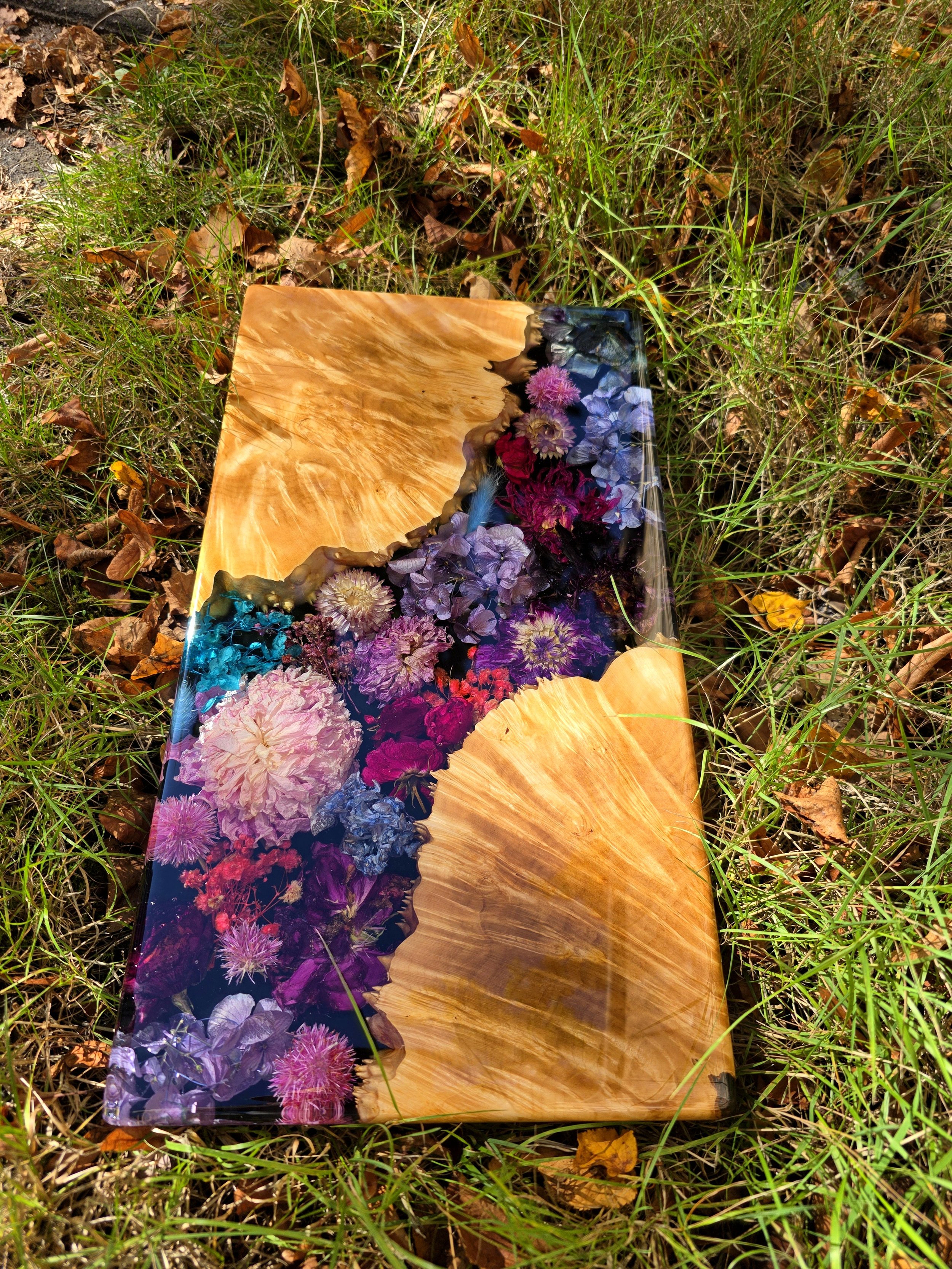 epoxy charcuterie board - live edge maple burl wood with bright spring flowers
