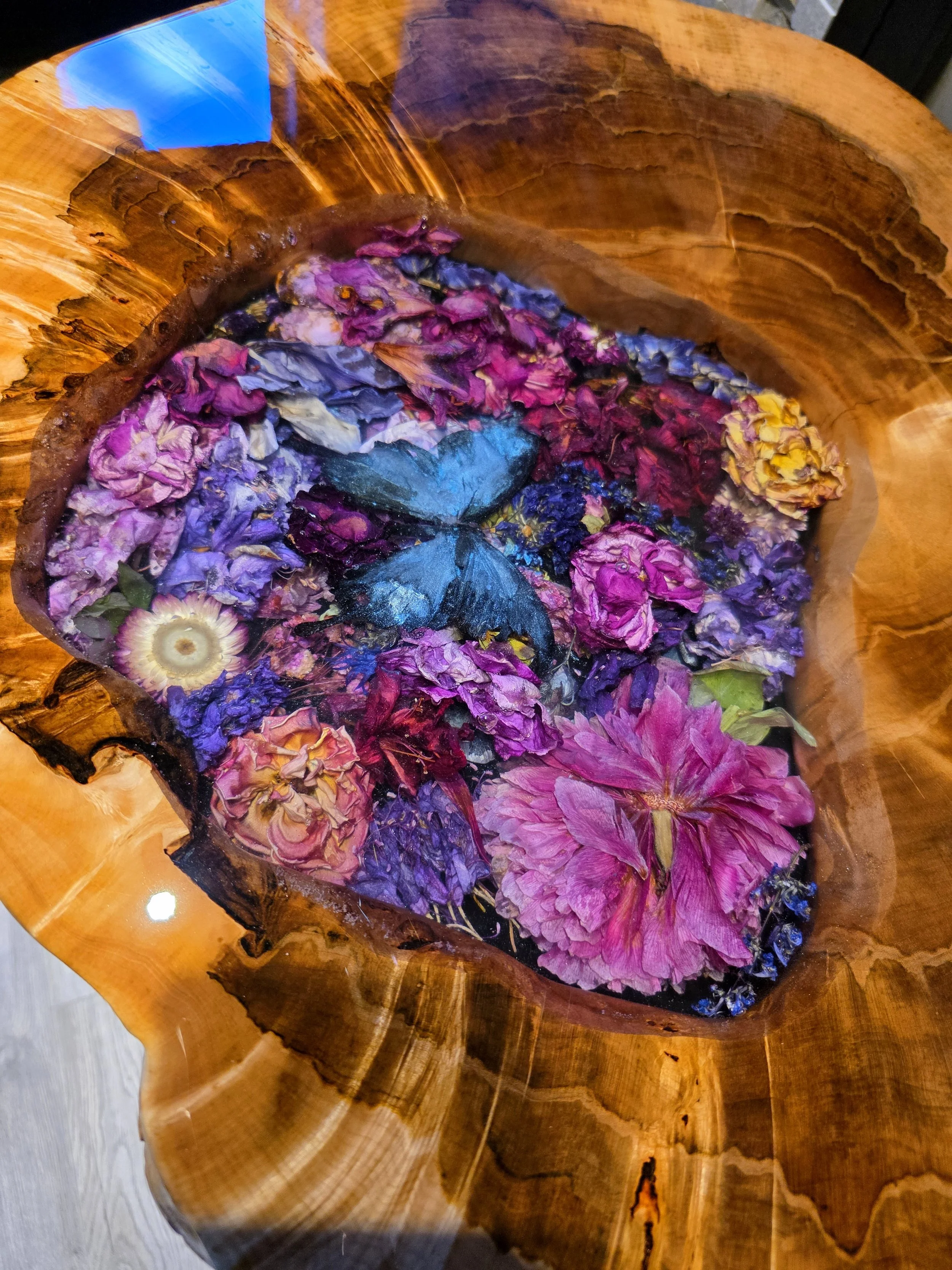 Epoxy resin table with live edge wood and dried flowers