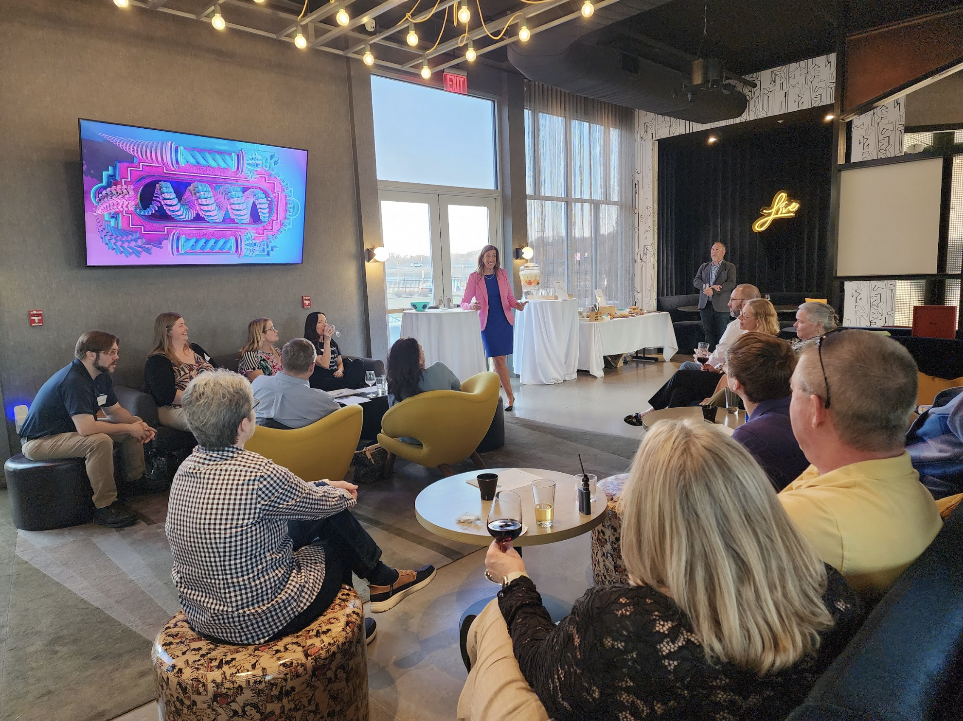 Kelly Landry of CONA Wealth makes a presentation to a group of clients about financial planning.