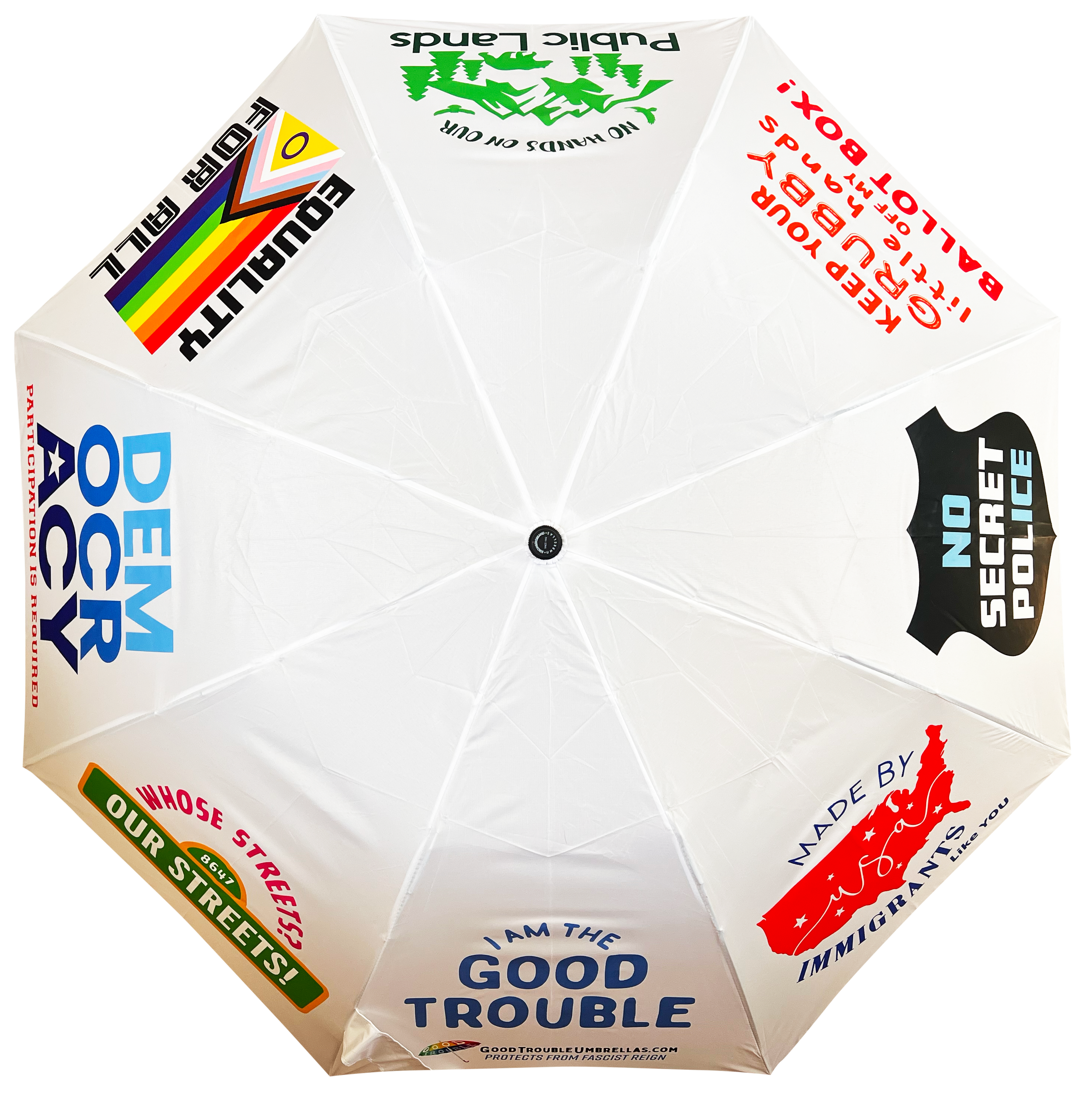 White umbrella with protest signs on each panel.